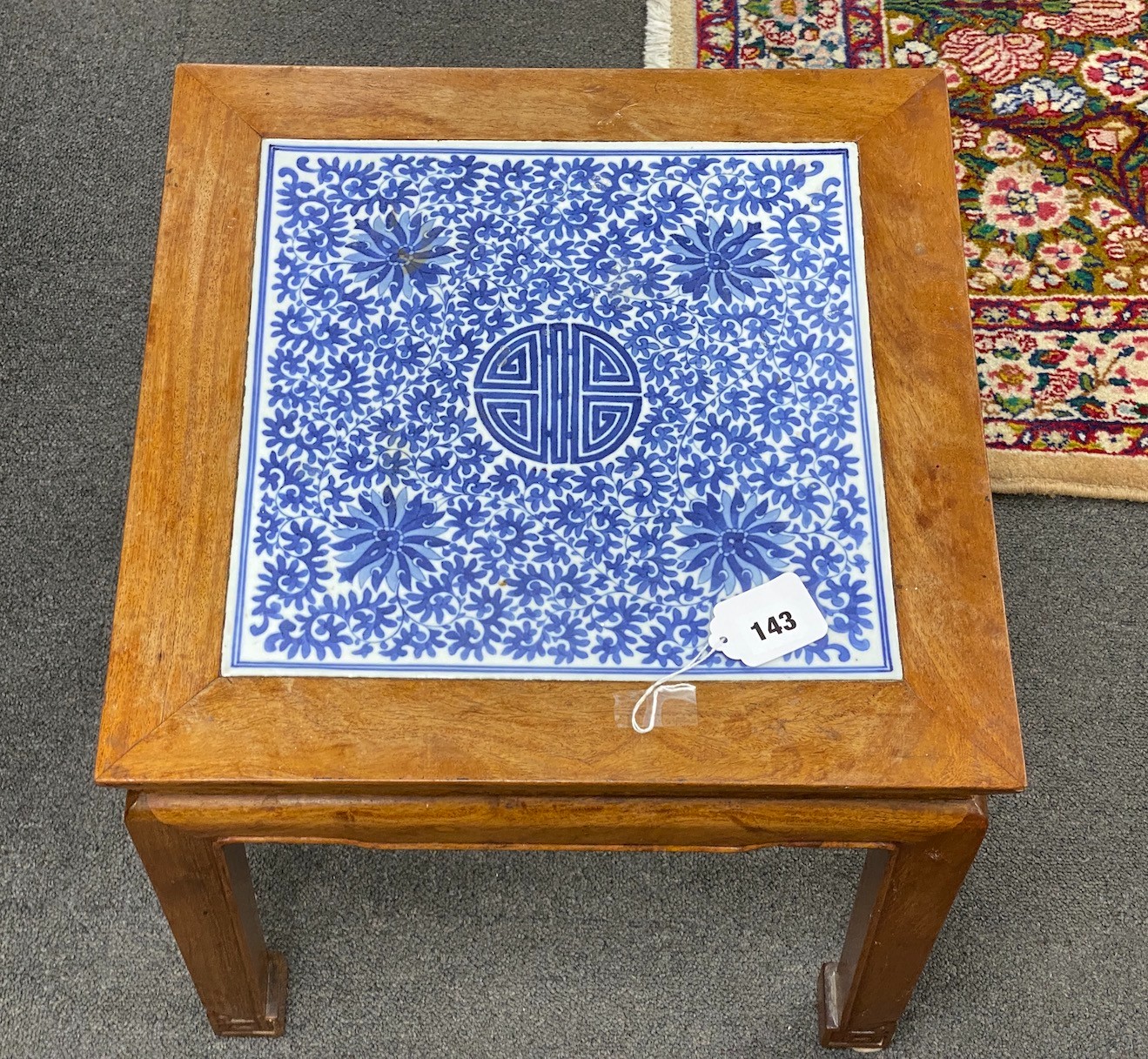 A Chinese hardwood and underglaze blue porcelain tile inset table, width 42cm, depth 42cm, height 43cm
